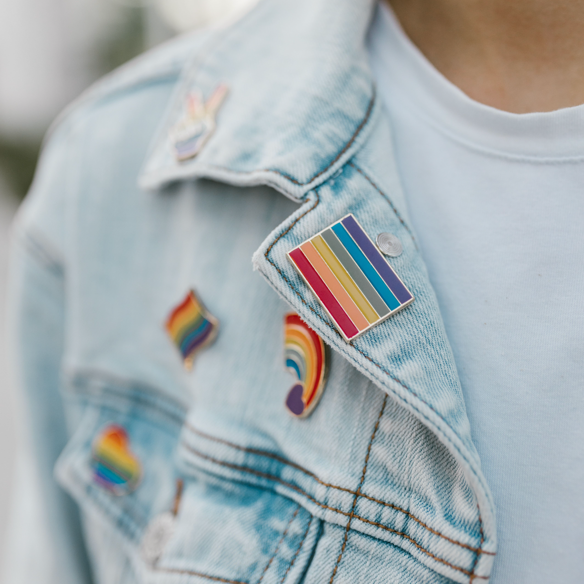 Rainbow Pride flag and LGBTQ+ themed enamel pins