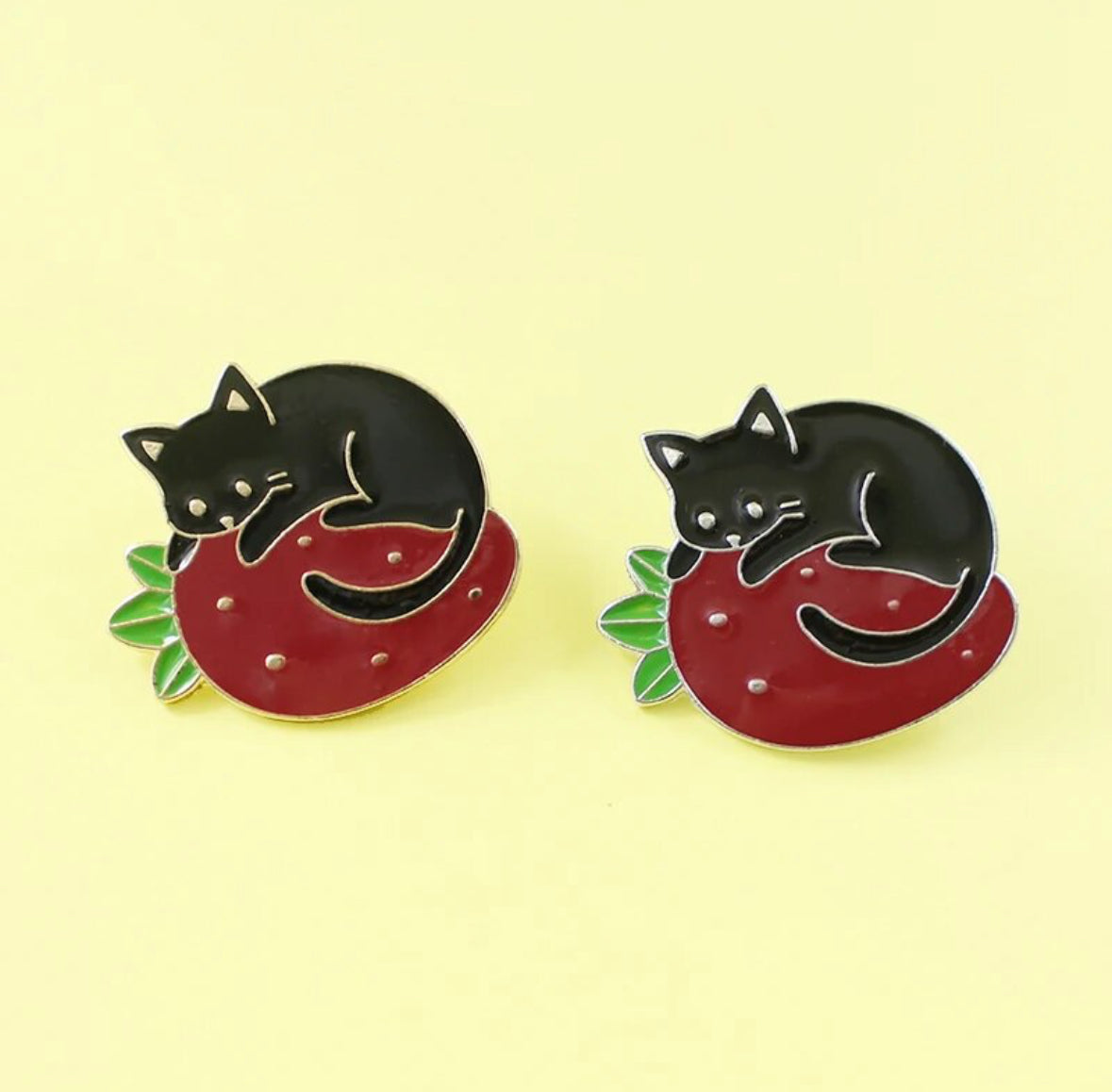 Cat on a Strawberry Pillow enamel pin